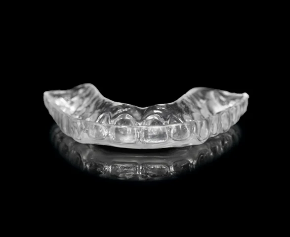 Clear nightguard on a black reflective surface